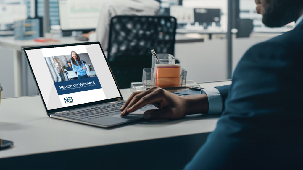 Successful Black Businessman Sitting at Desk Working on Green Screen Chroma Key Laptop Computer in Big City Office. Hard Working Top Manager Doing Research for e-Commerce Project. Over Shoulder
